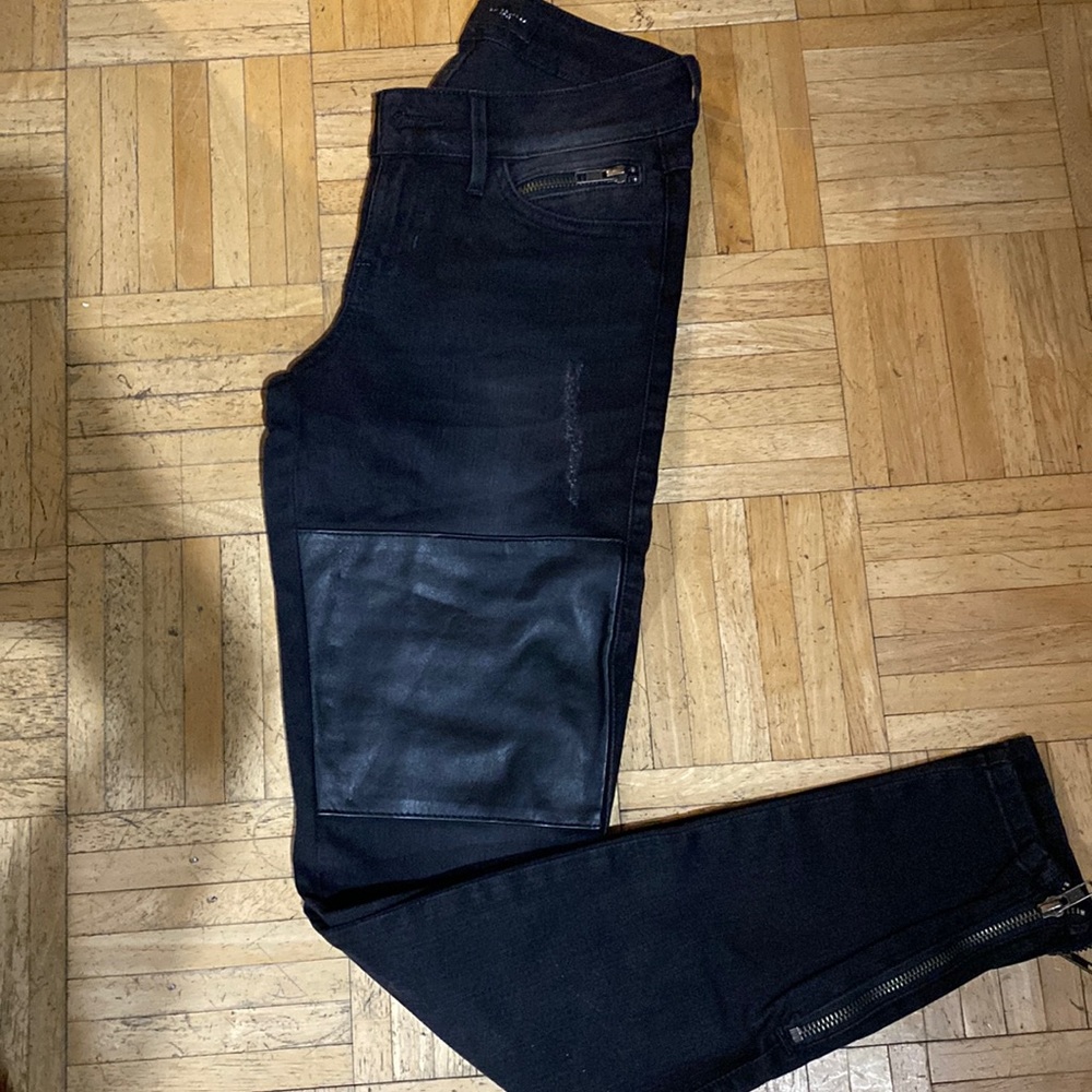 Guess black denim with leather patch. Beautiful detailing. Lightly distressed.